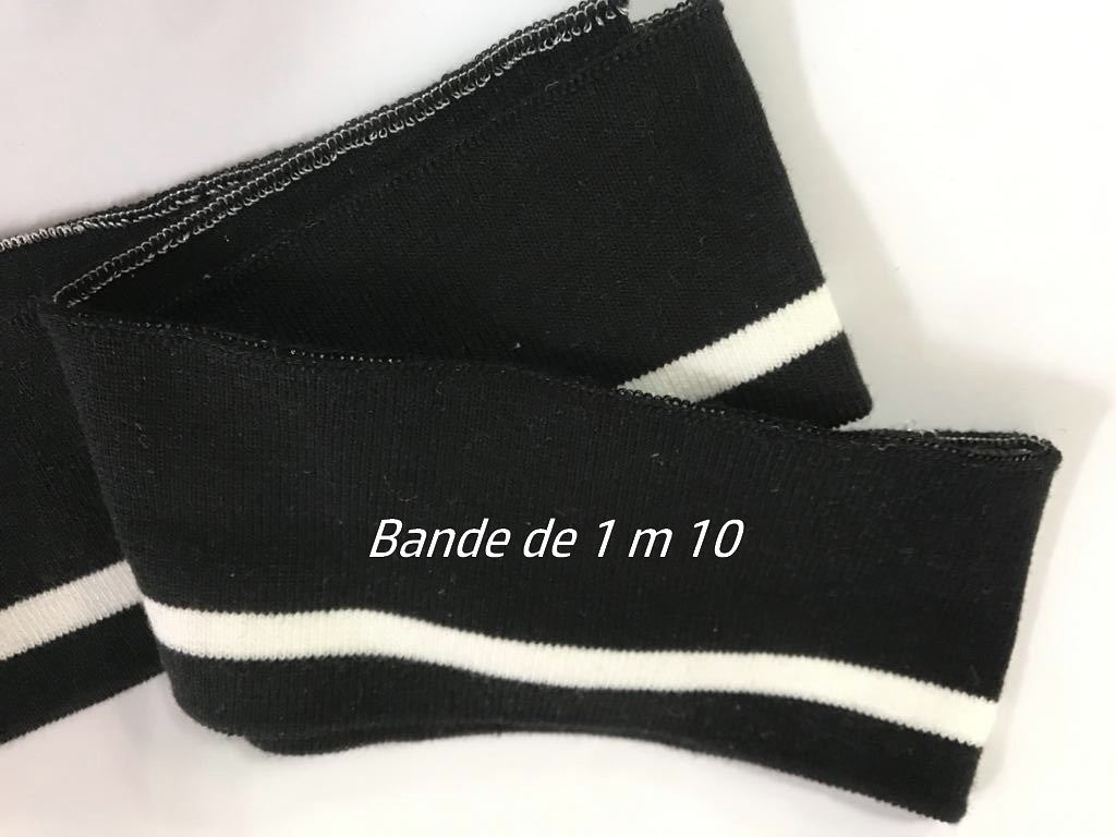 Bord-côte noir avec rayure blanche pour des finitions intemporelles.