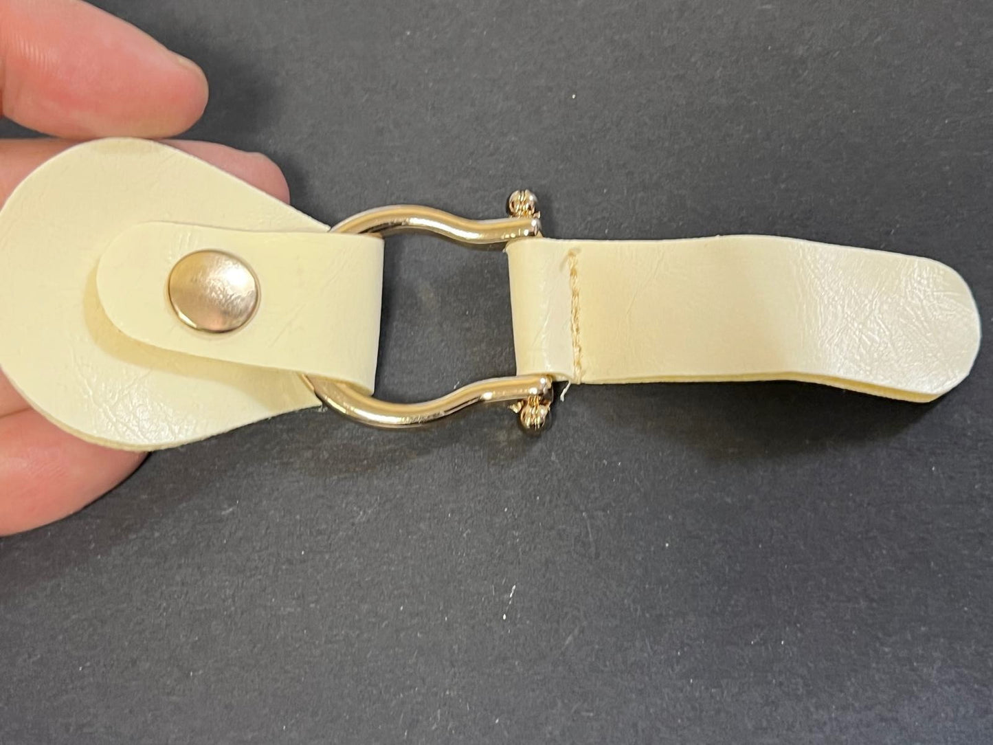 2-part fastening tab, cream imitation leather with gold snap button