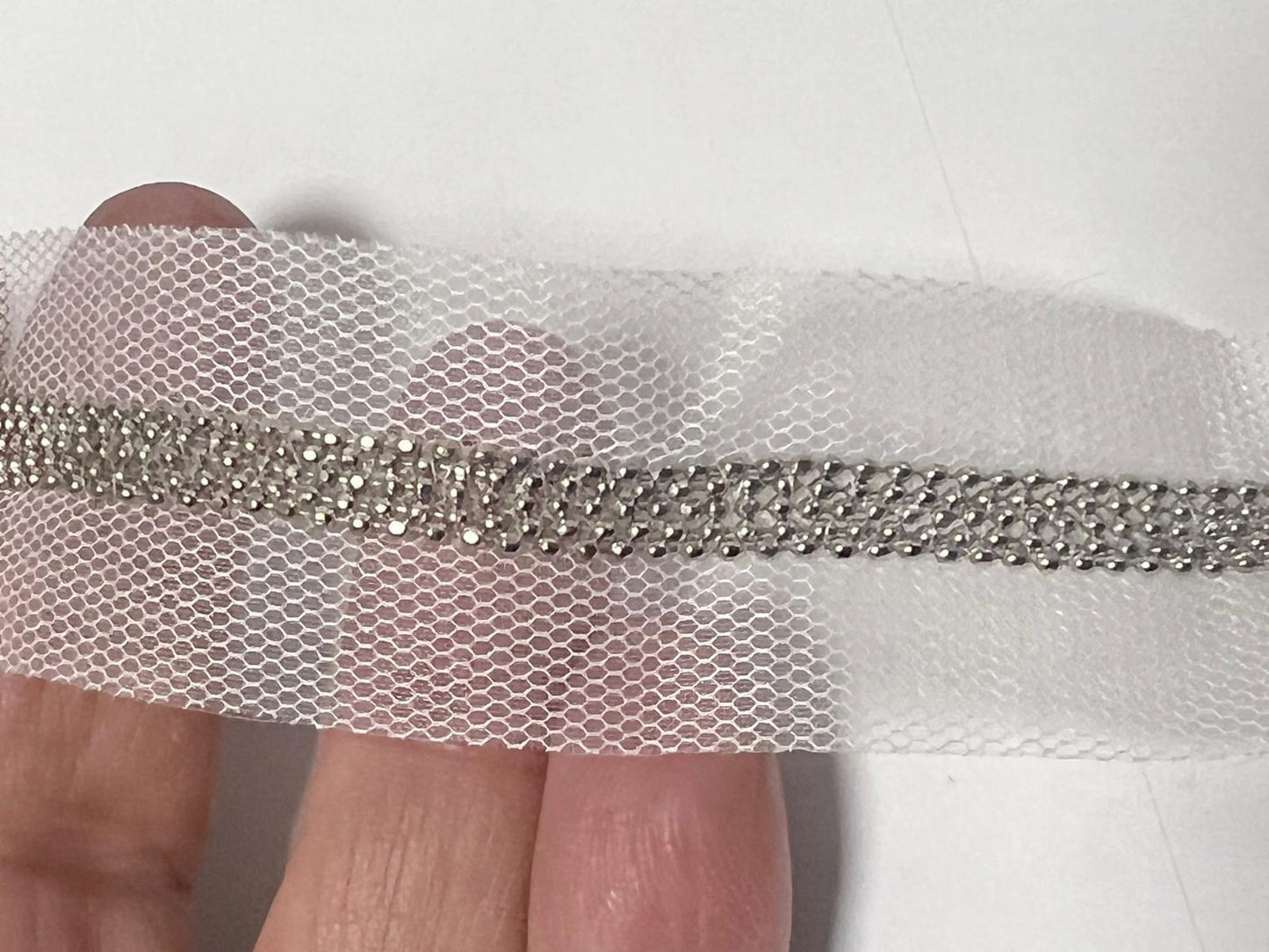 Ribbon Nails On white mesh to sew.