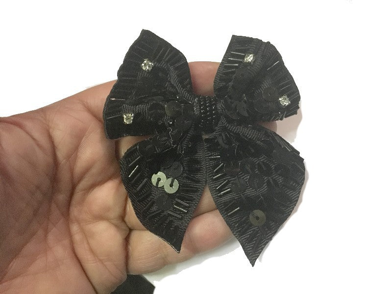 Broche de pajarita con perla negra