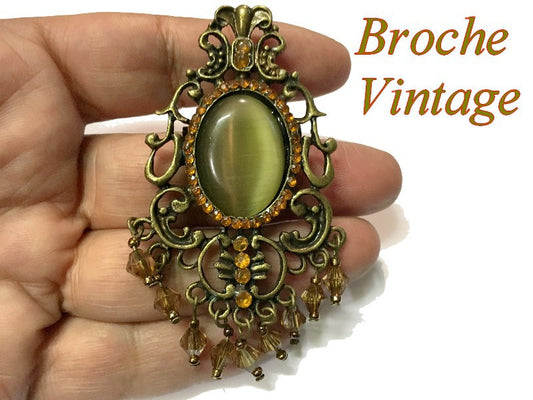 Broche vintage color caqui con diamantes de imitación sobre base de metal bronce para personalización.