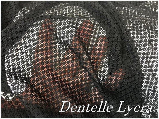 "Dentelle lycra noir brodée de motifs Ajourées en forme de rondelles : L'élégance pour des créations couture raffinées en noir."