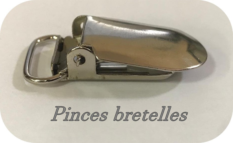 "Pinces à Bretelles métal argenté: Fixation Élégante"