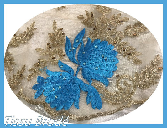 Couture Embroidered Fabric on Flesh Mesh Tulle with Indigo Blue and Gold Flower Patterns.