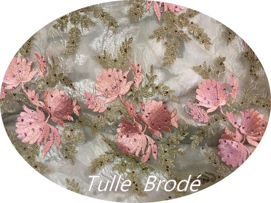 Embroidered Couture Fabric on Flesh-Colored Mesh Tulle with Pink and Gold Flower Patterns.
