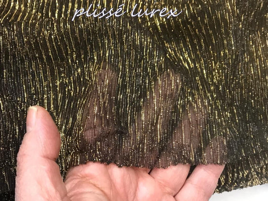 Tissu Plissé Lycra lamé lurex doré sur fond noir Couture
