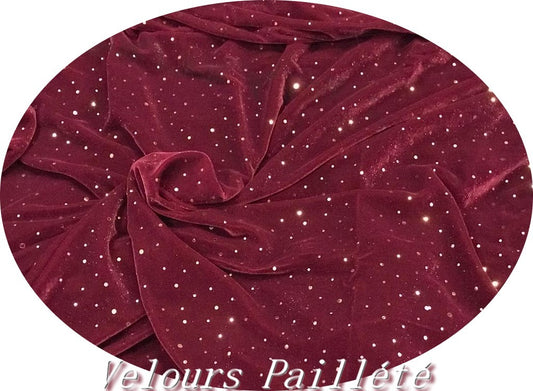 Tela de terciopelo burdeos con lentejuelas doradas, elegancia brillante.